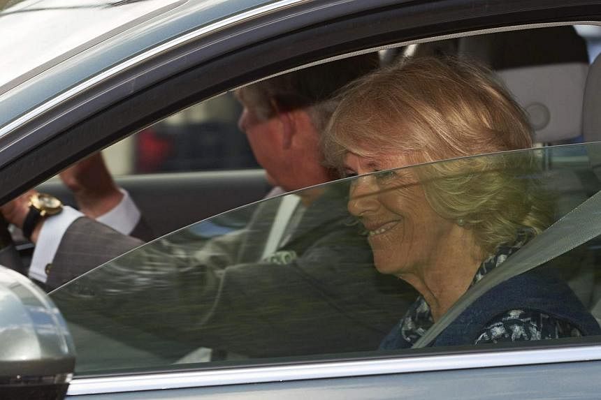 Britain's Prince Charles and wife Camilla, Duchess of Cornwall leave Kensington Palace on Sunday in London after visiting Prince William and wife Kate following the birth of their daughter. -- PHOTO: AFPAFP