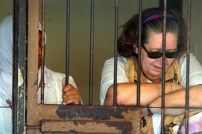 Lindsay Sandiford (right) of Britain reacting inside a holding cell after her trial at a court in Denpasar on the Indonesian resort island of Bali in a file photo taken on Nov 28, 2012. -- PHOTO: AFP