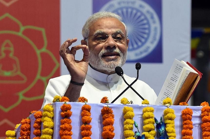 Indian Prime Minister Narendra Modi delivering a speech during International Buddha Poornima Diwas celebrations in New Delhi on May 4, 2015. Mr Modi attracted thousands of Internet users on Monday by opening an account on one of China's most popular 