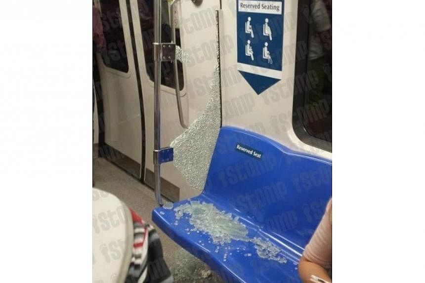 Train passenger Shah, who captured the incident in photos, told citizen journalism website Stomp that he heard "a loud noise" when the glass broke. -- PHOTO: STOMP