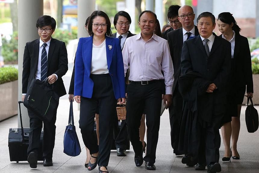 AHPETC and WP chairman Sylvia Lim, fellow Aljunied GRC MP Muhamad Faisal Abdul Manap (middle), lawyer Peter Low (second from right) and the rest of the town council's legal team arriving at the High Court yesterday.