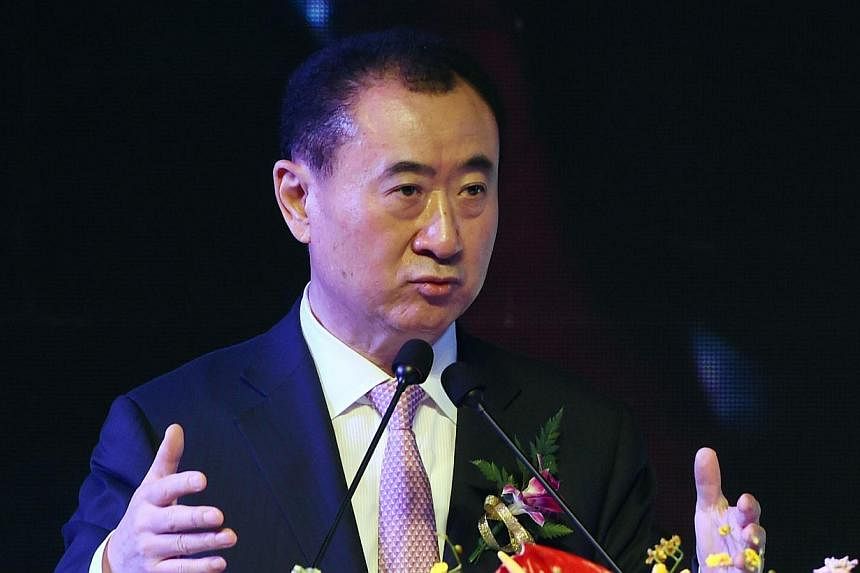 Wang Jianlin, chairman of Wanda Group, speaks at a ceremony in Beijing on Feb 10, 2015. -- PHOTO: AFP