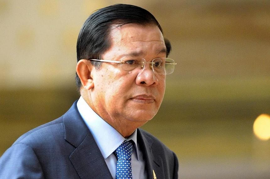 Hun Sen said he had made a US$5,000 bet with an official on the match outcome, a bet he would no longer honour.-- PHOTO: AFP&nbsp;