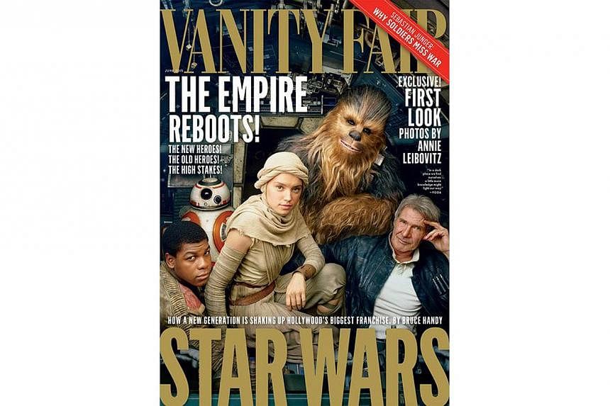 The Vanity Fair cover which shows Star Wars: The Force Awakens characters (from right) Han Solo (Harrison Ford) with the wookie Chewbacca, and newcomers Rey (Daisy Ridley), the droid BB-8 and Finn (John Boyega). -- PHOTO: VANITY FAIR/TWITTER