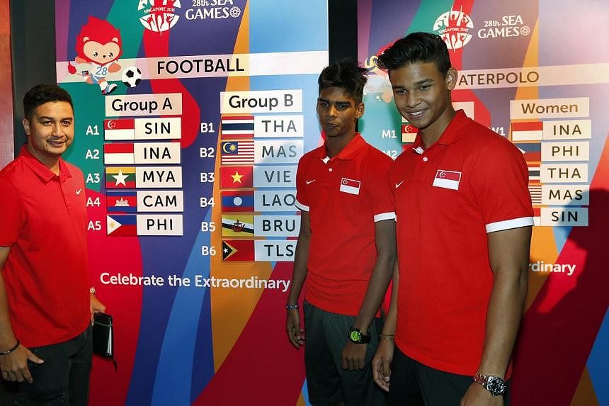 (From left) National Under-23 coach Aide Iskandar with players Iqbal Hussain and Irfan Fandi at the draw conducted on 15 April 2015 for the June SEA Games. The Lions will begin their SEA Games football campaign on June 1 against the Philippines. -- S