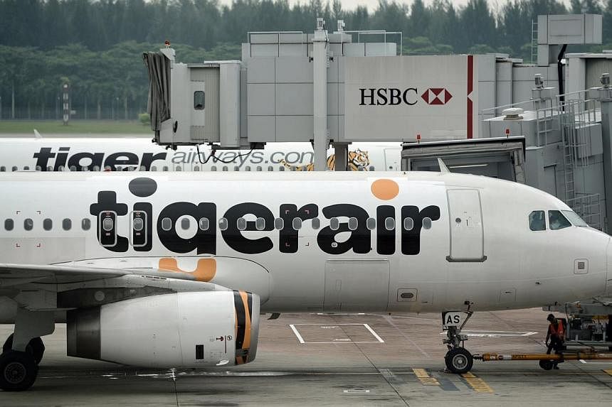 Singapore budget carrier Tigerair has narrowed its net loss to $18.8 million for the three months to March 31, 2015, from a $95.5 million loss for the same period last year. -- ST PHOTO:&nbsp;JOYCE FANG