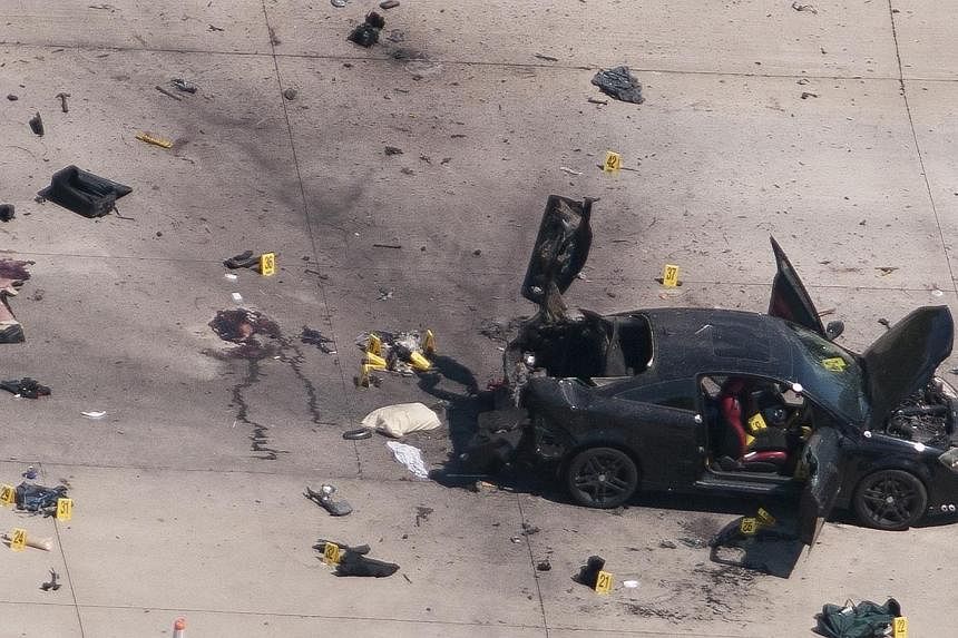 An aerial view shows the car that was used the previous night by two gunmen, who were killed by police, as it is investigated by local police and the FBI in Garland, Texas on Monday. -- PHOTO: REUTERS