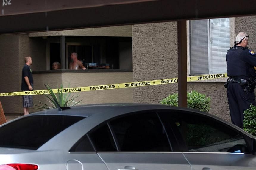 Phoenix Police set up crime tape near the home of one of the gunmen who opened fire at a Muhammad Art Exhibit and Contest the day before in Texas, at an apartment complex in Phoenix, Arizona on Monday. -- PHOTO: EPA