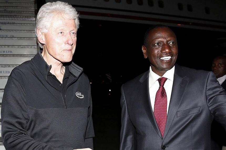 Kenya's Deputy President William Ruto (right) welcoming former US President Bill Clinton last week as he arrived at Jomo Kenyatta International Airport in Nairobi. -- PHOTO: AFP