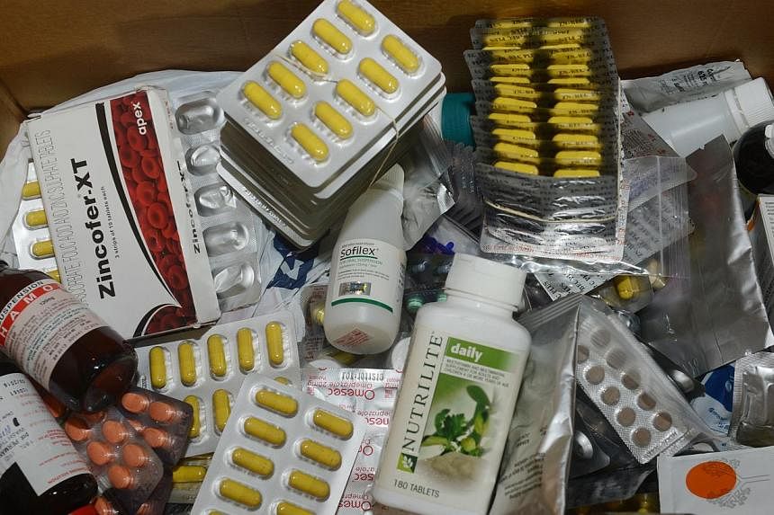 Expired medicine are among items donated by Singaporeans. -- PHOTO: LIANHE WANBAO&nbsp;
