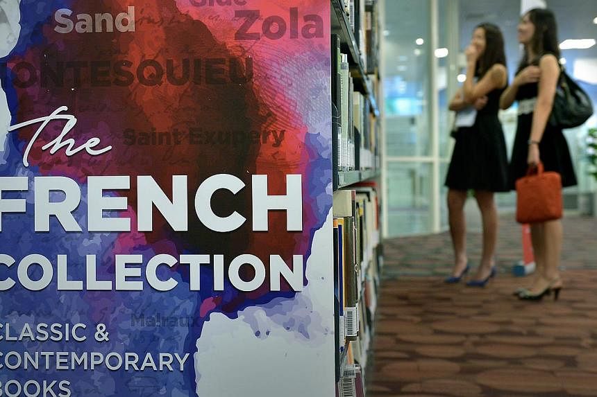 The public will now be able to borrow from the National Library Board's (NLB) collection of more than 1,000 French books, previously available for reference only. -- ST PHOTO: KUA CHEE SIONG