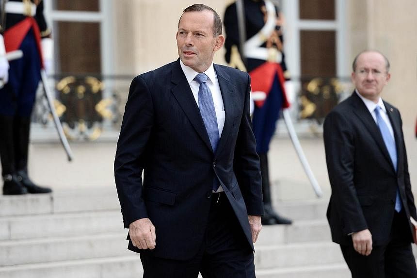 Australian Prime Minister Tony Abbott leaves the Elysee Palace in Paris after a meeting with France's President on April 27, 2015. Mr Abbott said on Wednesday that he was unaware the gay partner of his ambassador to France was asked "to wait in the c