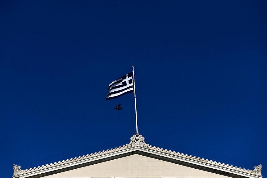 A Greek national flag flying atop the Parliament building in Athens on May 5, 2015. The Greek government has suggested imposing a special levy on the country's 500 richest families to help unlock bailout aid, German newspaper Bild said on Wednesday. 