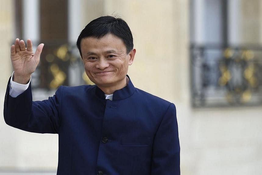 Alibaba founder Jack Ma waving to journalists as he arrives for a meeting with French President Francois Hollande at the Elysee Palace in Paris on March 18, 2015. After Alibaba raised a record US$25 billion (S$33 billion) last year, Mr Ma said the Ch