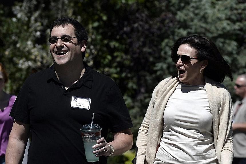 Sheryl Sandberg, chief operating officer of Facebook, and husband David Goldberg (left), chief operating officer of SurveyMonkey, attending the Allen and Company 31st Annual Media and Technology Conference. Sandberg re-emerged in public on Tuesday af