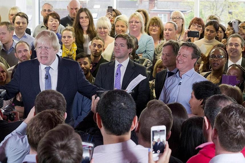 On the campaign trail, London Mayor Boris Johnson (left) was constantly asked if he would replace Mr David Cameron (right) as the next PM. -- PHOTO: AGENCE FRANCE-PRESSE