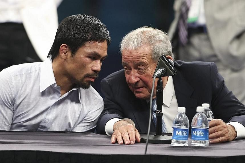 Boxing Promoter Bob Arum (right) with Manny Pacquiao (left) attending a press conference after Pacquiao's defeat by Floyd Mayweather Jr. &nbsp;following their welterweight unification championship boxing fight at the MGM Grand Garden Arena in Las Veg
