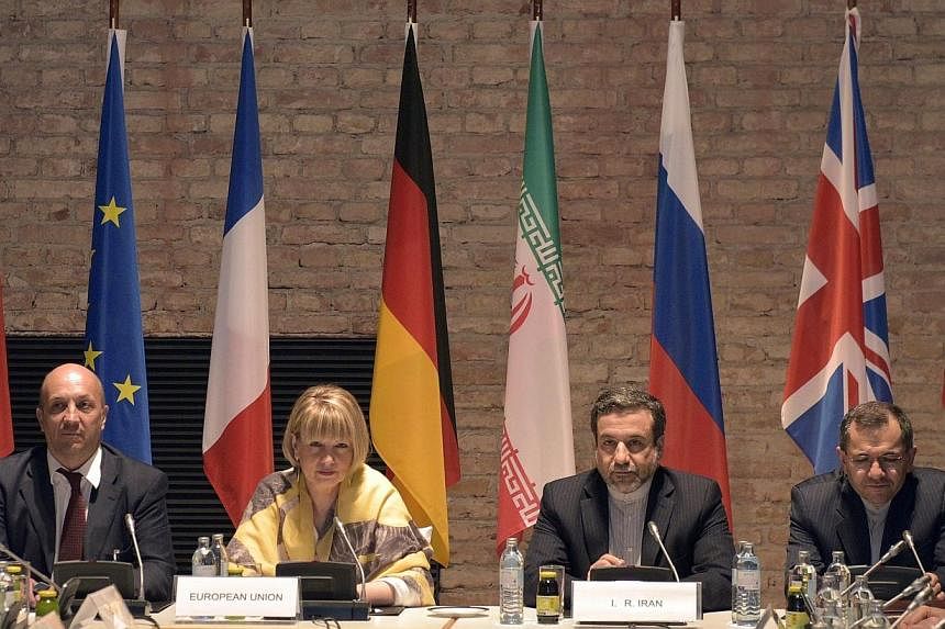 EU-director Helga Schmid (centre left) and Iranian Deputy Foreign Minister Abbas Araghchi (centre right), during talks between France, Germany, Britain, China, Russia, the United States and Iran in Vienna on 24 April 2015. -- PHOTO: EPA