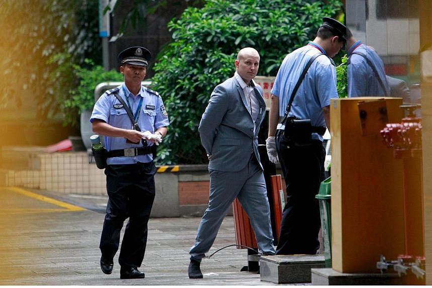 Police escort Australian Peter Gardner as he enters court in Guangzhou, Guangdong province, China on May 7, 2015. He faces a possible death sentence on Thursday on charges of attempting to smuggle millions of dollars worth of drugs out of China. -- P