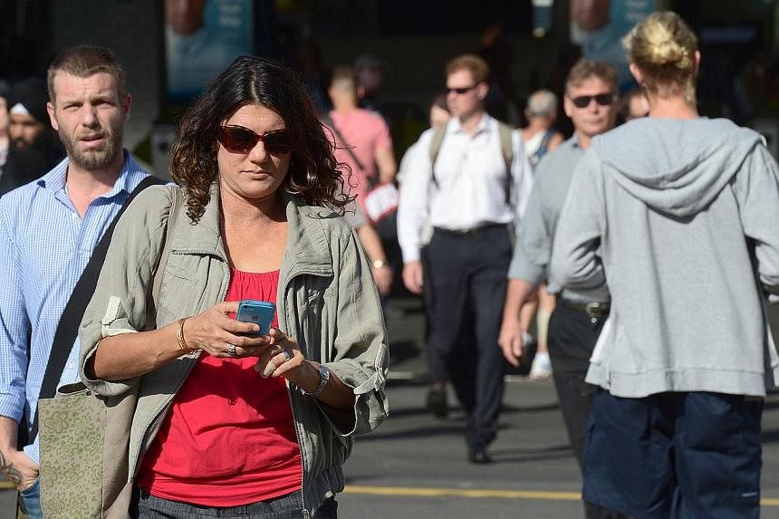 Pedestrians in Melbourne's Central Business District on Feb 10, 2015. Australia's unemployment rate edged up to 6.2 per cent in April, official figures showed on Thursday, in a widely expected increase reflecting the nation's economic wobbles as it m