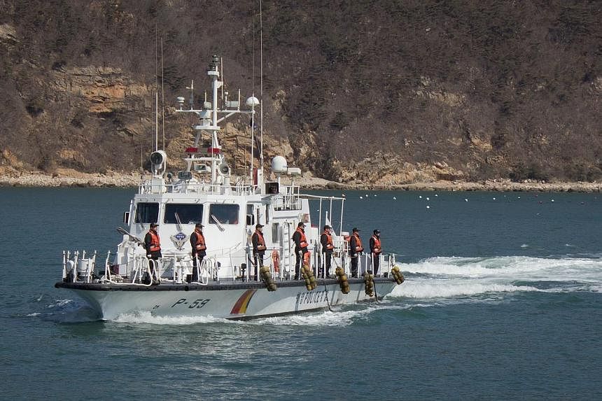 This photograph taken on March 24, 2015 shows a South Korean coastguard cutter during an unveiling event on the country's northernmost island of Baengnyeong. -- PHOTO: AFP