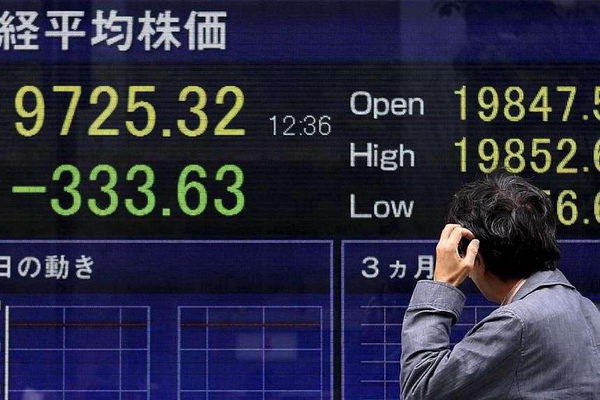 Asian stocks and bonds retreated, extending a global rout, as Japan returned from a three-day holiday. -- PHOTO: REUTERS