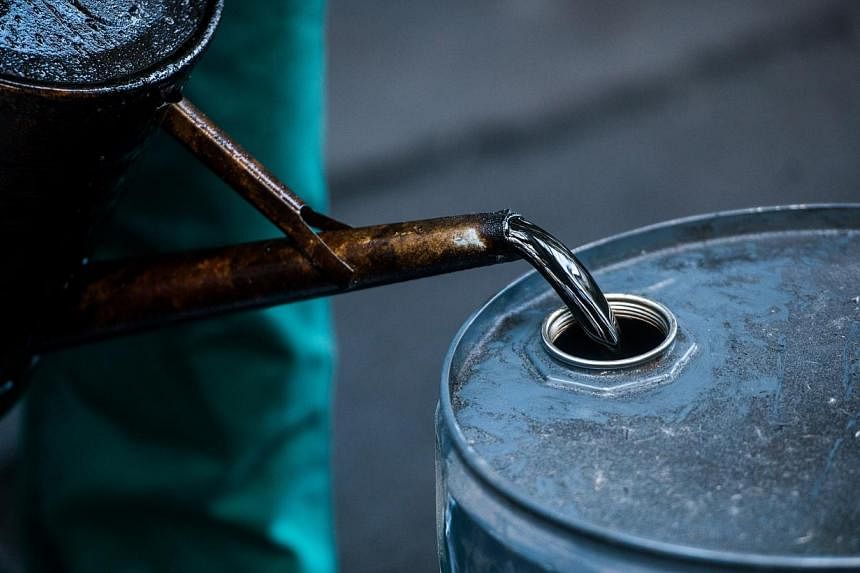 Oil prices fell on Thursday morning in Asian trading after hitting 2015-highs in the previous session as traders moved to take profits on a multi-week rally. -- PHOTO: BLOOMBERG