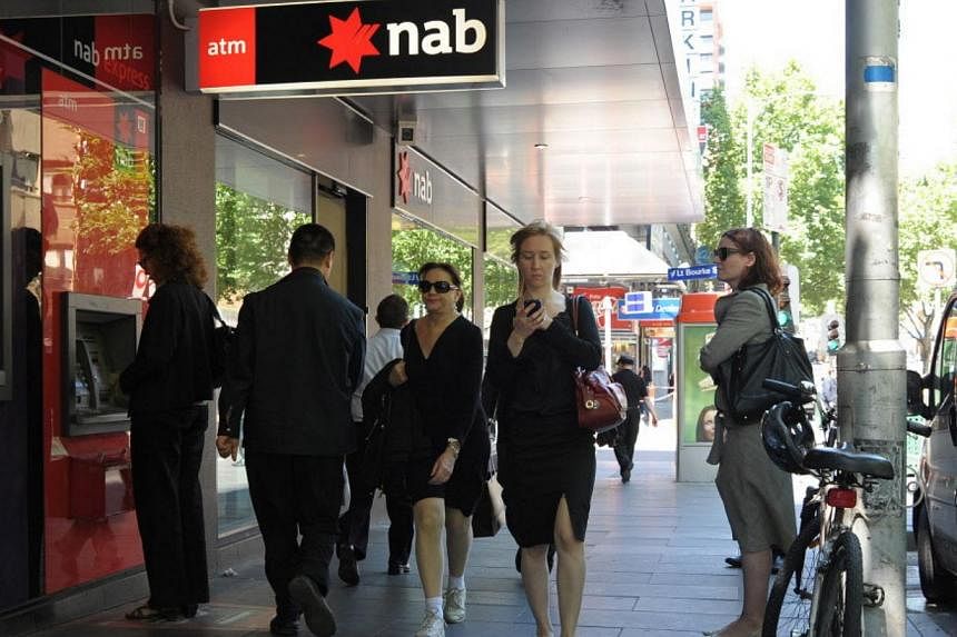 National Australia Bank, the country's top lender by assets, on Thursday reported a 5.4 per cent rise in first-half cash earnings, meeting forecasts, and announced a A$5.5 billion (S$5.8 billion) rights issue as it looks to demerge and float its trou