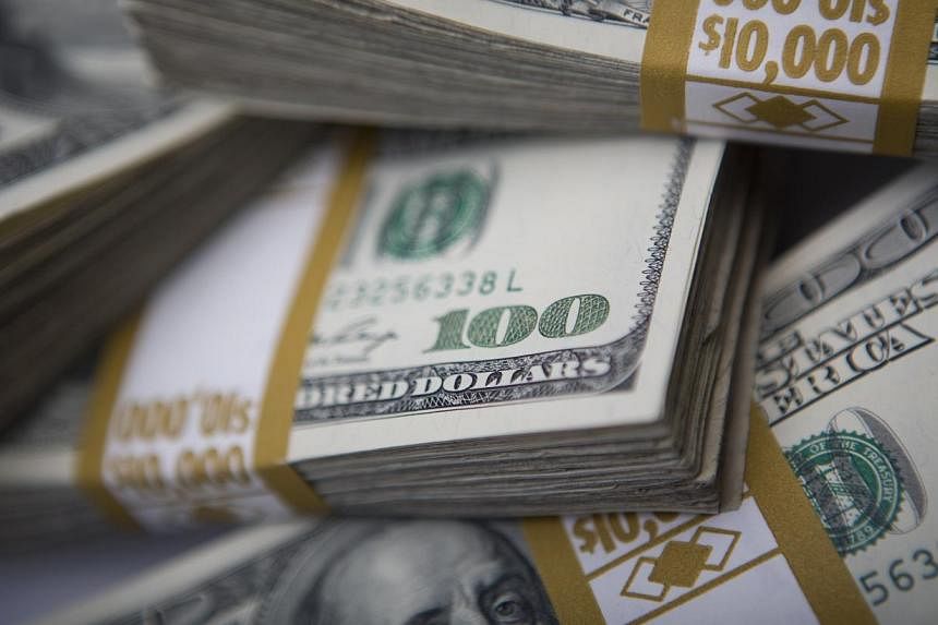 The US dollar fell sharply Wednesday after weaker-than-expected US economic data and a warning from Federal Reserve Chair Janet Yellen that stock valuations were "quite high". -- PHOTO:&nbsp;BLOOMBERG