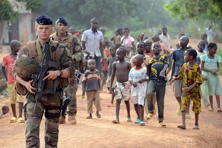 French soldiers patrol a street in Bangui, part of 'Operation Sangaris', on May 2, 2015. Faced with mounting pressure to shed light on accusations that French soldiers sexually abused children in the Central African Republic, the United Nations said 