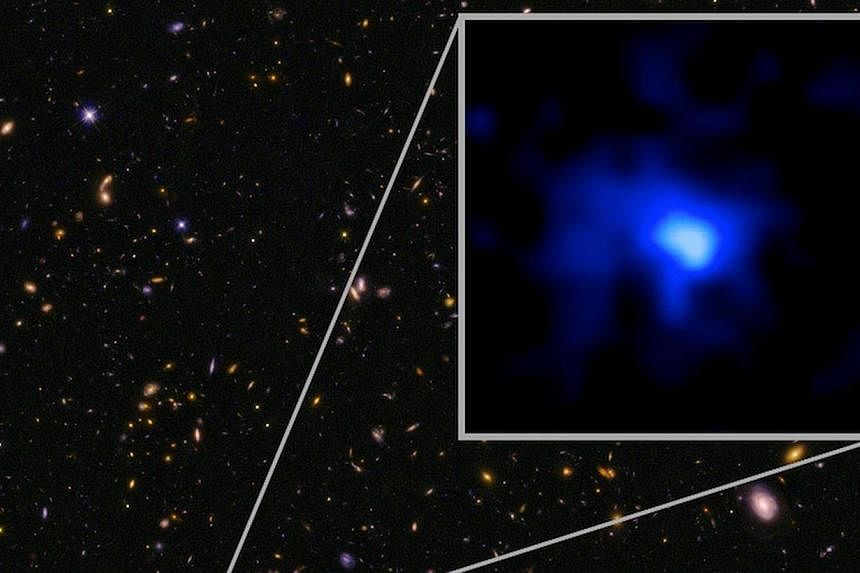 This image released by the W.M. Keck Observatory in Hawaii shows the farthest confirmed galaxy observed to date. The inset image of the galaxy is blue, suggesting very young stars. -- PHOTO: AFP&nbsp;