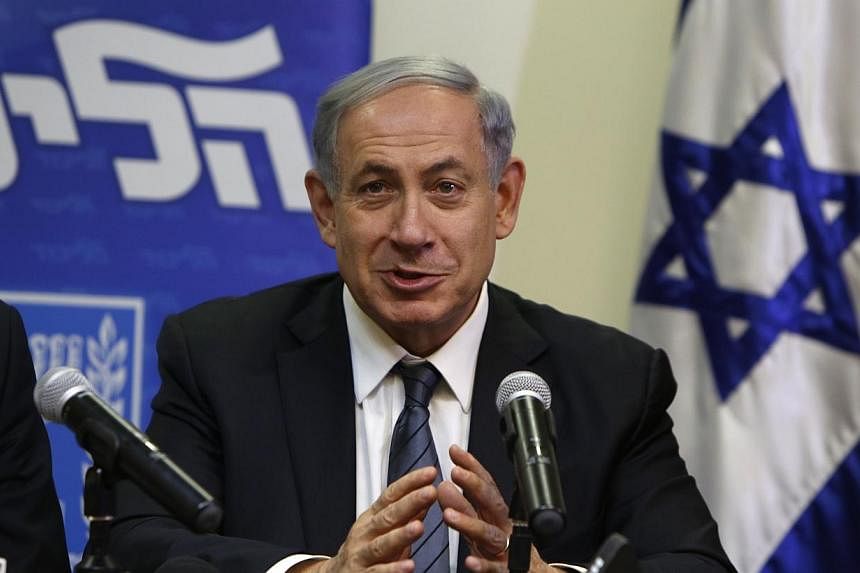 Israeli Prime Minister Benjamin Netanyahu speaks during a press conference at the Knesset in Jerusalem late on Wednesday to announce the formation of a coalition government and reaching an agreement with the religious nationalist Jewish Home party. -
