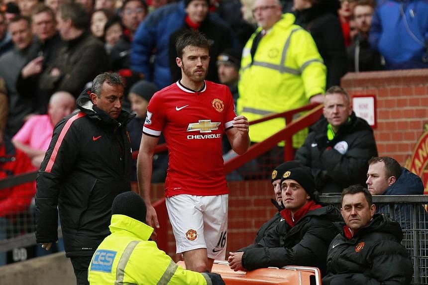 England midfielder Michael Carrick suffered a calf injury during the 4-2 win over Manchester City on April 12, 2015. -- PHOTO: REUTERS