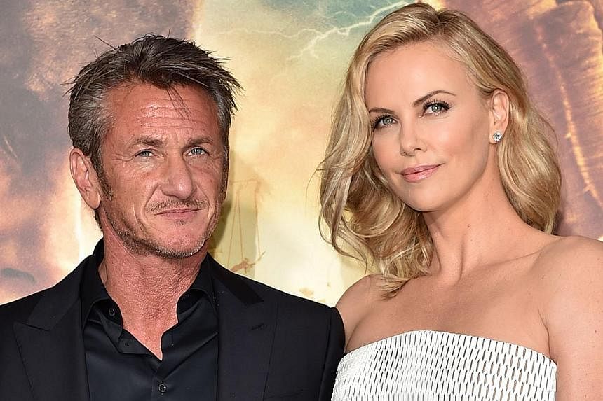 Actors Sean Penn (left) and Charlize Theron (right) at the premiere of Mad Max: Fury Road on May 7, 2015, in Hollywood, California. Theron managed to negotiate an equal salary for The Huntsman after leaked Sony e-mails showed the disparity between pa