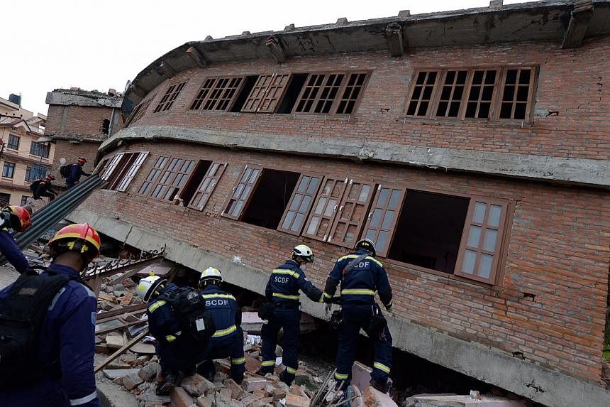 Singapore Civil Defence Force (SCDF) officers searching for survivors in Lalitpur, Nepal. The Singapore contingent in Nepal will return home in the coming days as their mission ends, the Ministry of Foreign Affairs (MFA) said on Friday. -- ST PHOTO: 