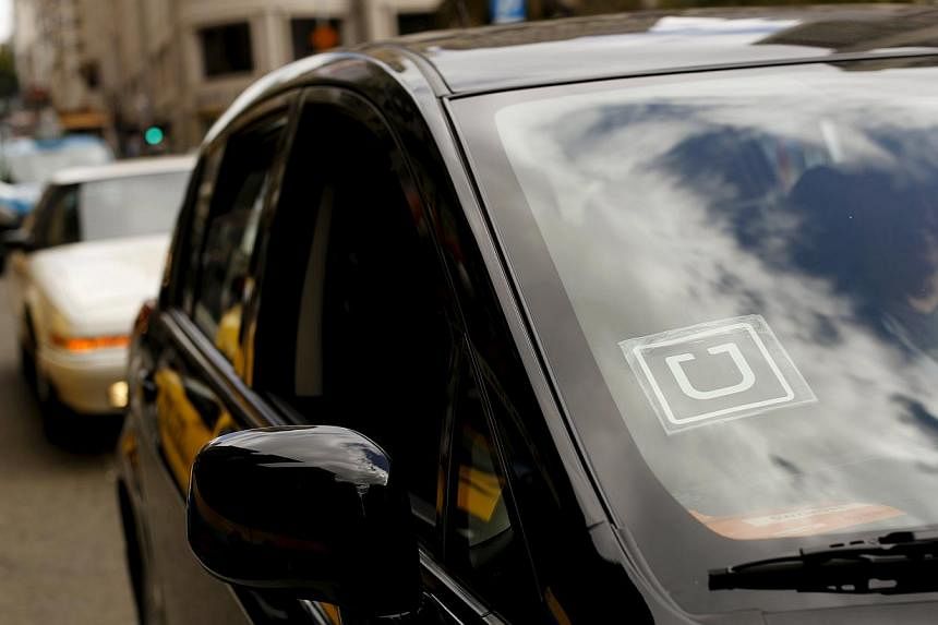 The Uber logo is seen on a vehicle near Union Square in San Francisco, California on May 7, 2015. -- PHOTO: REUTERS