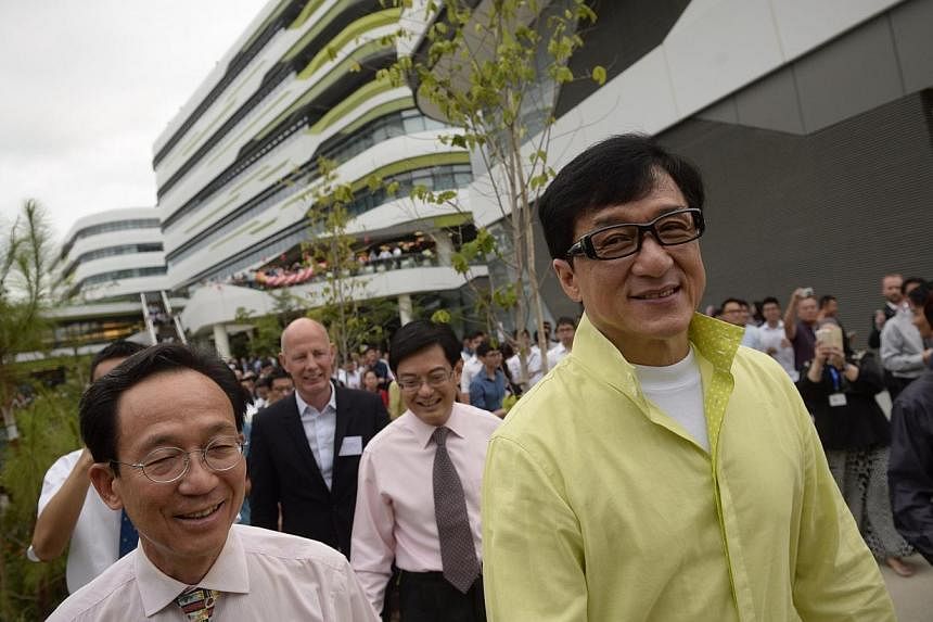 Actor Jackie Chan tours the Singapore University of Technology and Design&nbsp;campus during its official opening on May 8, 2015.&nbsp;-- ST PHOTO: MARK CHEONG