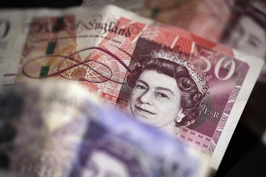 The British pound climbed the most in seven weeks as an exit poll indicated the Conservative Party was on track to lead a minority government after the UK election. -- PHOTO: BLOOMBERG