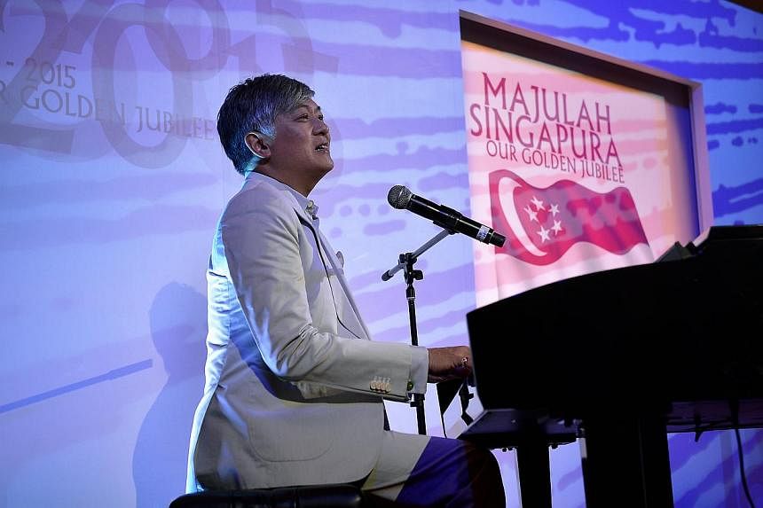 Composer Dick Lee performing this year's Golden Jubilee National Day song Our SIngapore when he unveiled it two days ago. -- ST PHOTO: KUA CHEE SIONG&nbsp;