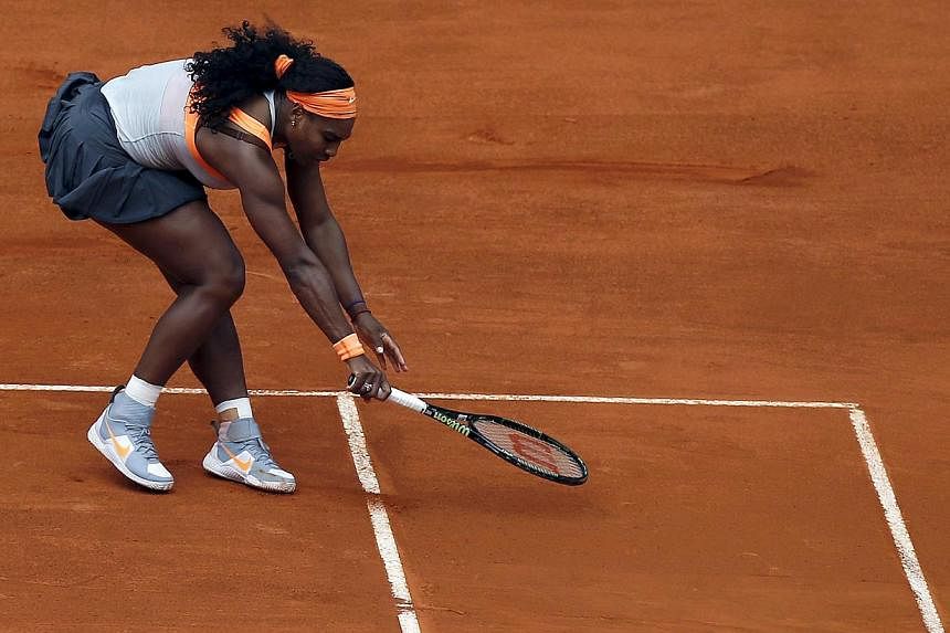 Serena Williams of the U.S. tries to return the ball to Petra Kvitova of the Czech Republic during their semi-final match at the Madrid Open tennis tournament in Madrid, Spain, May 8, 2015. -- PHOTO: REUTERS&nbsp;