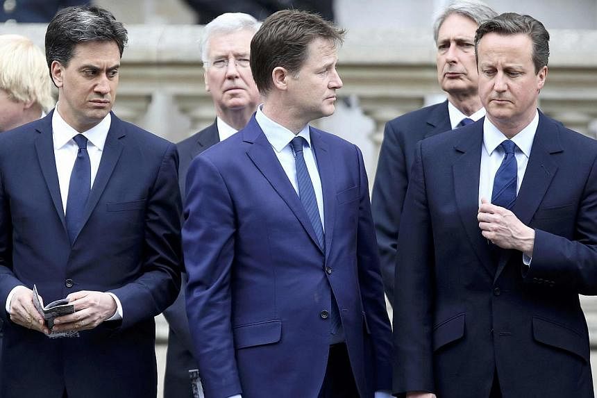 Ed Miliband (left) who today resigned as leader of the Labour Party, Nick Clegg who today resigned as leader of the Liberal Democrats (centre), and Britain's Prime Minister David Cameron (right) pay tribute at the Cenotaph to mark the 70th anniversar