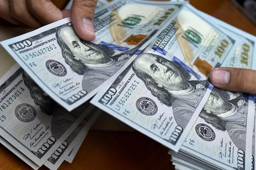 The dollar rose in Asian trade on fresh expectations the US central bank may raise interest rates in the second half of the year, analysts said. -- PHOTO: AFP