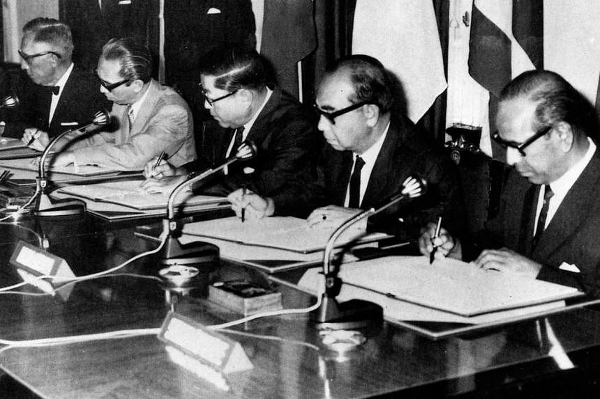 Mr S. Rajaratnam (right), then Singapore's Foreign Minister, at the historic 1967 Bangkok meeting, which saw the founding of Asean. With him are envoys (from left) Narciso Ramos from the Philippines, Adam Malik from Indonesia, Thanat Khoman from Thai