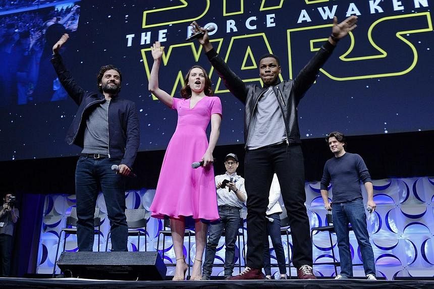 Cast members (from left) Oscar Isaac, Daisy Ridley, John Boyega of Star Wars: The Force Awakens at the kick-off event during Disney's Star Wars Celebration 2015 at the Anaheim Convention Center on April 16, 2015. -- PHOTO: AFP