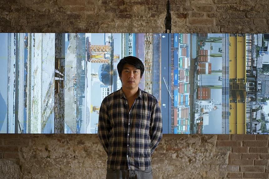 Artist Charles Lim and his installation Sea State at the Singapore Pavilion of the Venice Biennale 2015. -- ST PHOTO: WEE LI LIN
