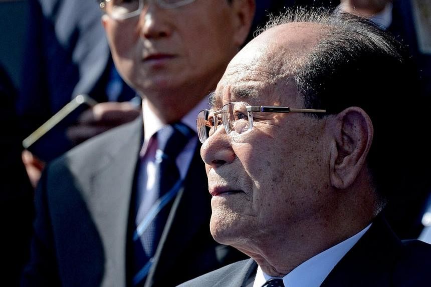 North Korean Chairman of the Presidium of the Supreme People's Assembly Kim Yong Nam (front) watches the Victory Day Parade in the Red Square in Moscow, Russia, on May 9, 2015. -- PHOTO: EPA&nbsp;