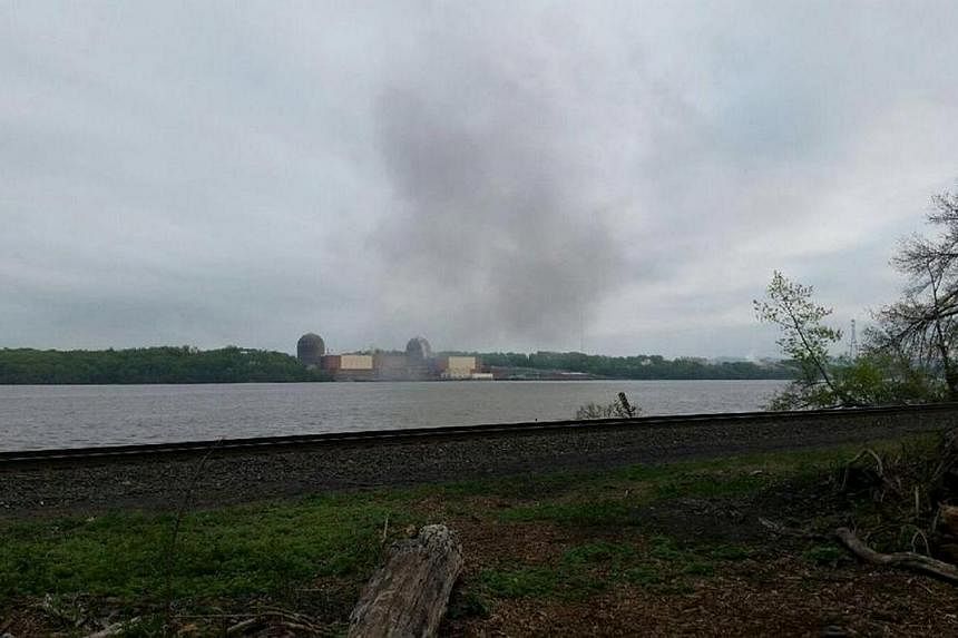 Smoke is seen over the Indian Point nuclear power plant in New York, in this handout photo provided by Gustavus Gricius taken on May 9, 2015.&nbsp;A nuclear power reactor to the north of New York City was shut down on Saturday after a transformer fir