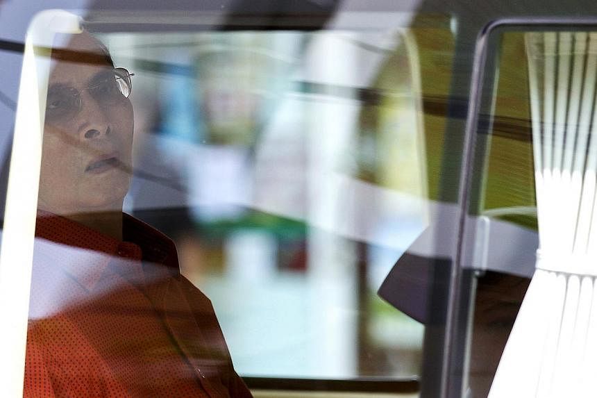 Thailand's King Bhumibol Adulyadej sits in a vehicle as he leaves Siriraj Hospital in Bangkok, Thailand on&nbsp;May 10, 2015, after seven months spent convalescing following surgery last year, to the joy of many in Thailand where the king is widely r
