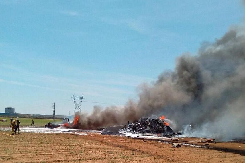 A handout picture released by the Spanish Police shows the wrekage of an Airbus A400 military plane which crashed in the San Pablo airport in Seville, southern Spain on May 9,&nbsp;2015. Spanish authorities on Sunday, May 10, found the two cockpit re