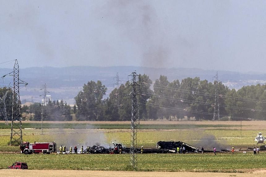 Smoke rises from the wreckage of an Airbus A400 which crashed in the San Pablo airport in Seville, southern Spain on May 9,&nbsp;2015. Britain, Germany and Turkey said on Sunday, May 10, that they were temporarily grounding their Airbus A400M militar